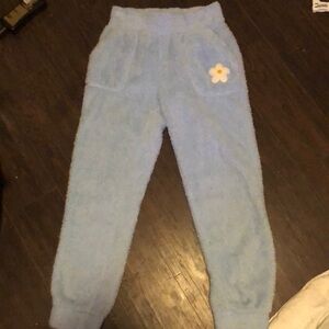 Blue, fluffy textured sweatpants, no drawstrings.